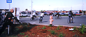 Photo of Police chasing bicyclists at Target near the end of the Critical Mass ride. Photo by Ella Docherty